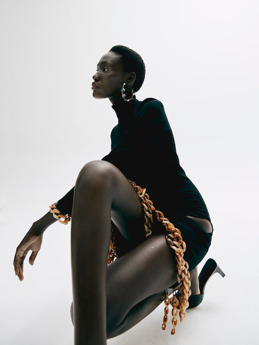 Noir Asymmetrical Hem Dress with Tortoise Chain Accents